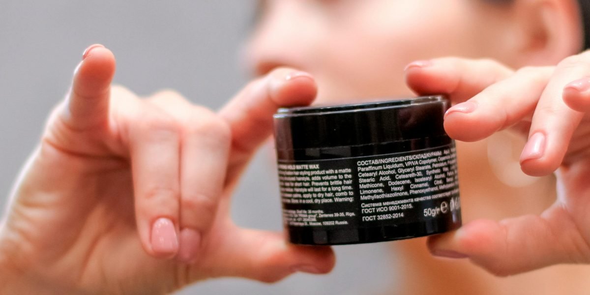 A person carefully examining product labels, emphasizing the importance of safety and third-party certifications.