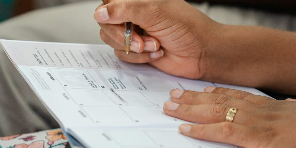 A person organizing their running and strength training schedule to optimize performance and recovery.