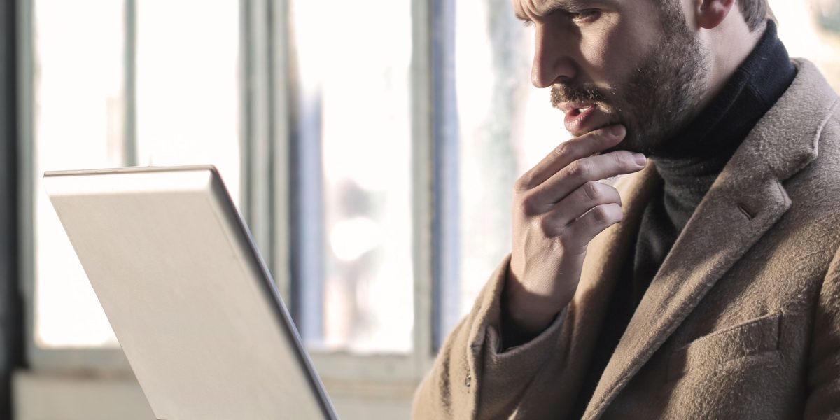 A person thoughtfully considering options, emphasizing the decision-making process.