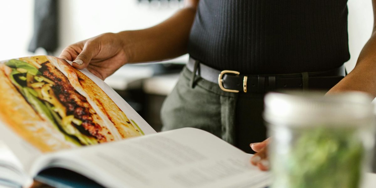 A person carefully selecting ingredients or preparing a meal, emphasizing the importance of dietary protein sources for lysine intake.